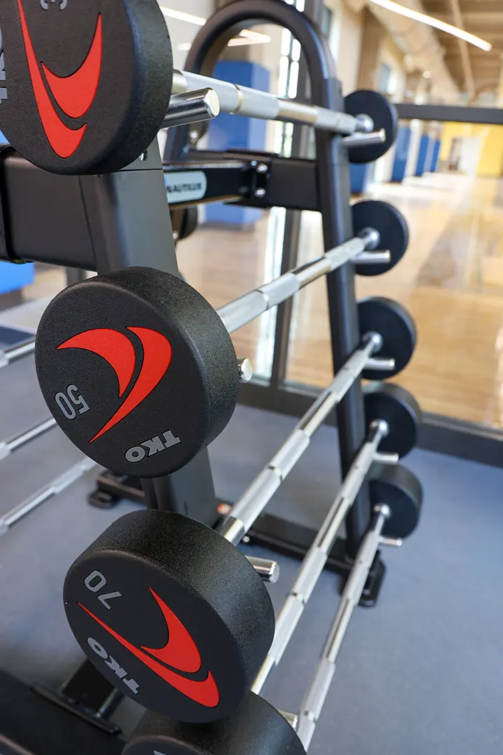 A tower of barbells with weights on them